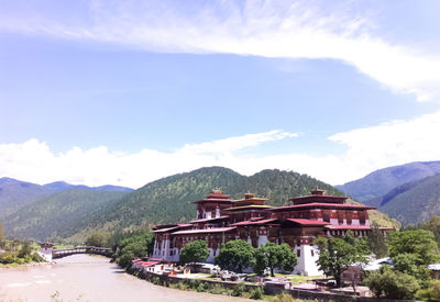 View of buildings against cloudy sky