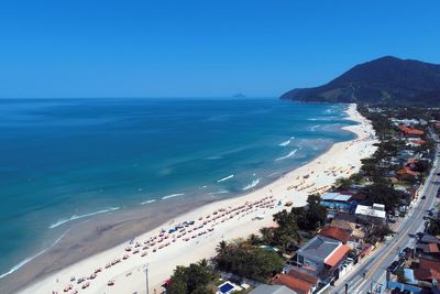 High angle view of sea against clear blue sky