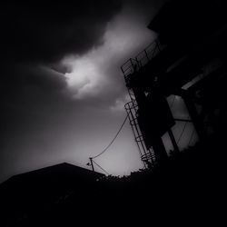 Low angle view of building against cloudy sky