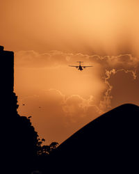 Low angle view of silhouette mountain against sky during sunset