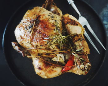 Directly above shot of roast chicken served on table