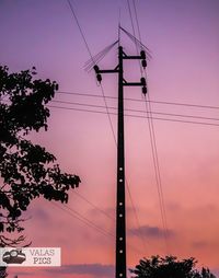 Low angle view of silhouette electricity pylon against sky at sunset