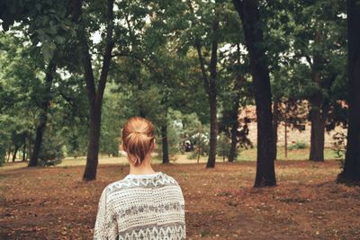 Woman looking at trees