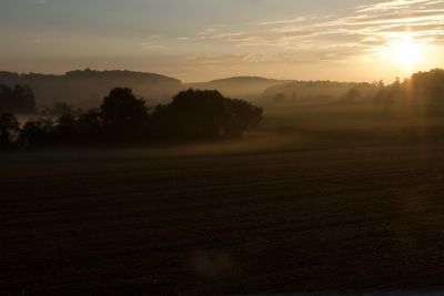Scenic view of landscape against sky during sunset
