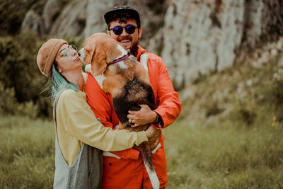 Couple in love with a beagle dog
