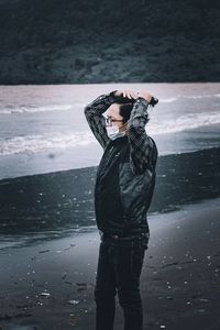 Full length of man standing in sea