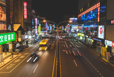 Light trails on road in city at night