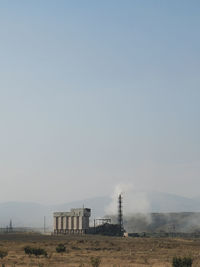 Built structure on field against clear sky