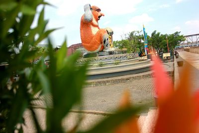 Surface level of statue against sky