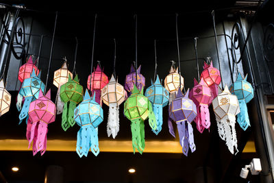 Low angle view of lanterns hanging in store