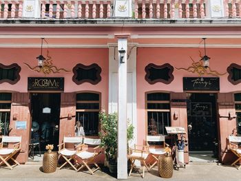 Chairs and tables in front of building