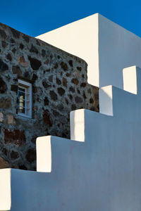 Low angle view of building against clear blue sky