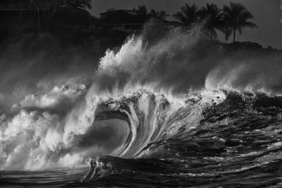 Large waves curling and crashing at waimea bay