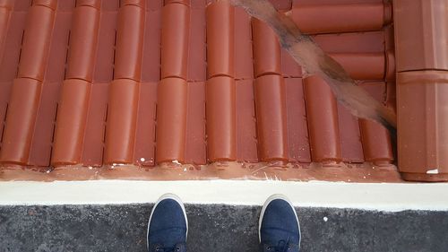 Row of objects on tiled floor