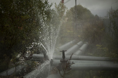 Burst pipe. water pouring. pipeline accident. it's dangerous situation. jets of boiling water.