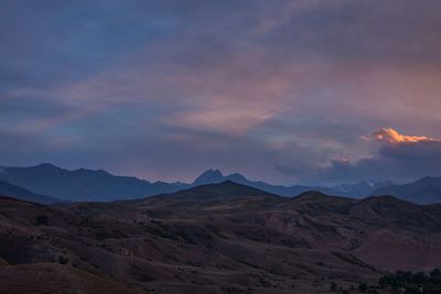 Scenic view of desert against sky during sunset