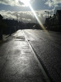 Sun shining over road