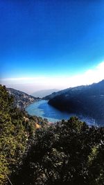 Scenic view of sea against blue sky
