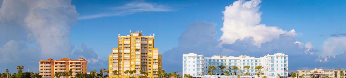 Low angle view of buildings against blue sky