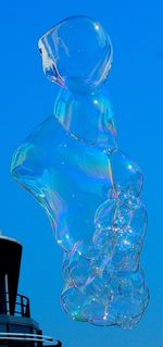 Close-up of water against blue sky