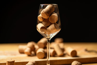 Close-up of drink on table against black background