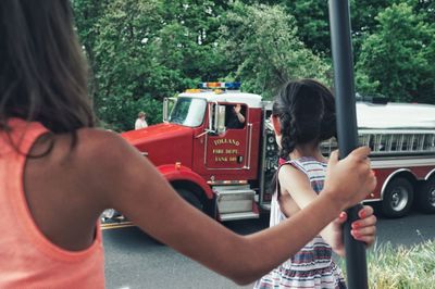 Woman photographing through train