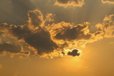 Low angle view of dramatic sky during sunset