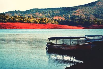 Scenic view of lake with mountains in background