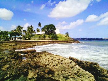 Scenic view of sea against cloudy sky