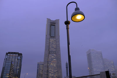 Low angle view of modern building against sky at night