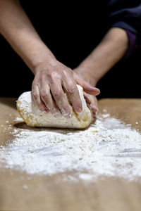 Midsection of person preparing food on table