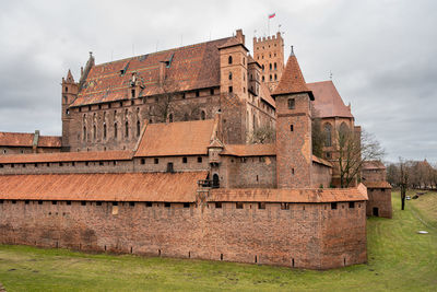 Low angle view of old ruins against sky