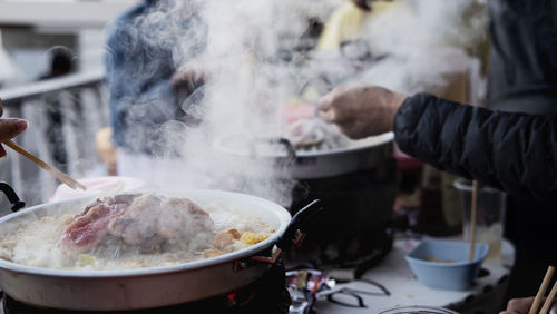 Midsection of person preparing food