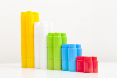 Close-up of colored pencils against white background