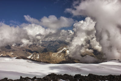 Aerial view of landscape against cloudy sky