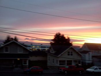 Buildings in city at sunset