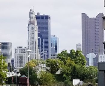 Modern buildings in city against sky