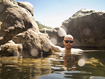 Portrait of man swimming in lake