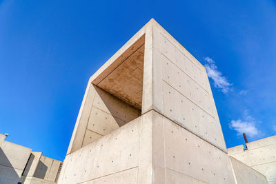 Low angle view of building against blue sky