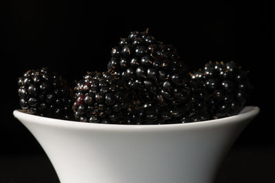 Close-up of bowl against black background