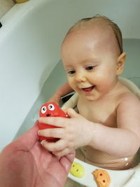 High angle view of cute baby girl in bathtub