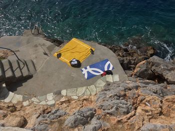 High angle view of towel on rock at beach