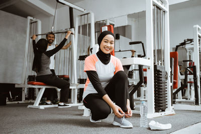 Young woman exercising in gym