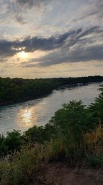Scenic view of lake against sky during sunset
