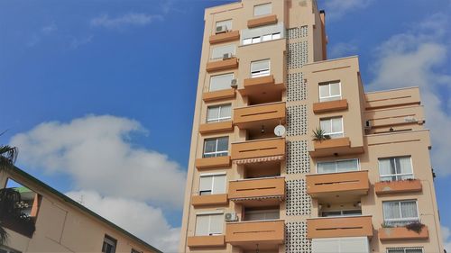 Low angle view of residential building against sky