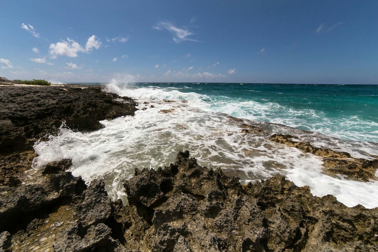 sea, water, horizon over water, scenics, wave, beauty in nature, rock - object, nature, surf, sky, tranquil scene, blue, tranquility, beach, motion, shore, rock formation, idyllic, splashing, day