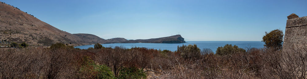 Panoramic view of landscape against blue sky