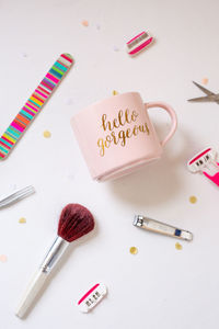 Directly above shot of mug amidst various objects on table