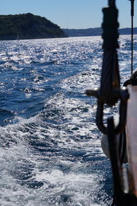 Sailboat on sea against sky