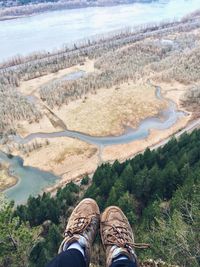 Cropped image of person legs on cliff over columbia river gorge